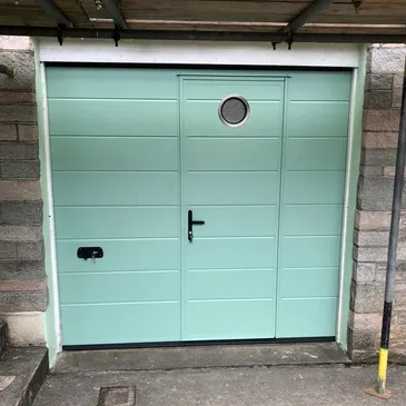 blue garage door with door